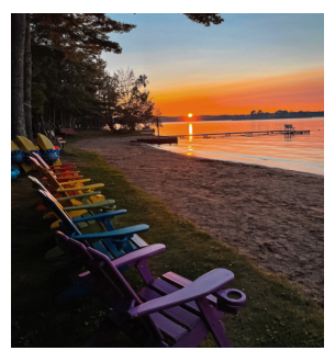 Lawn chairs on grass near beach and lake in St. Germain, Wisconsin